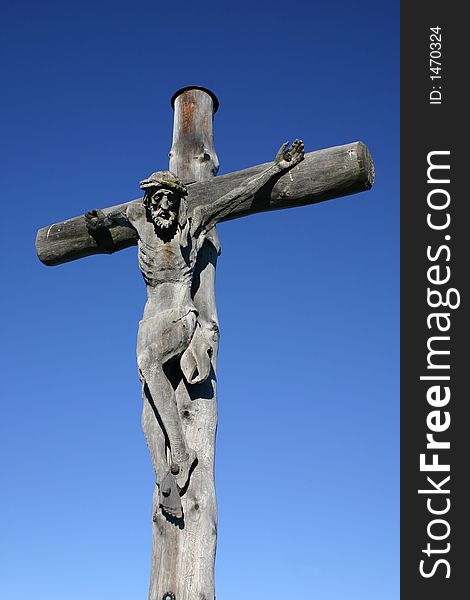 Cross on the peak of a mountain. Interesting wooden structure. Cross on the peak of a mountain. Interesting wooden structure