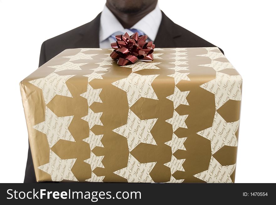 This is an image of a businessman holding a big parcel, to be offered as a christmas present. This is an image of a businessman holding a big parcel, to be offered as a christmas present.