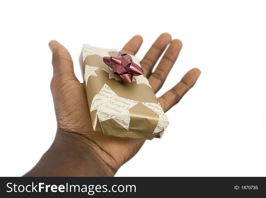 This is an image of a hand offering a christmas present. This is an image of a hand offering a christmas present.