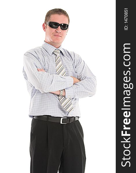 Serious businessman wearing black sunglasses and his arms crossed. Serious businessman wearing black sunglasses and his arms crossed