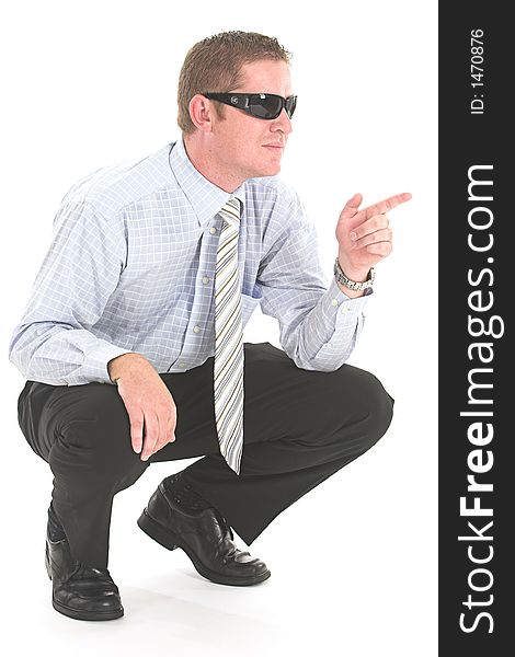 Man in business outfit and black sunglasses pointing finger. Man in business outfit and black sunglasses pointing finger