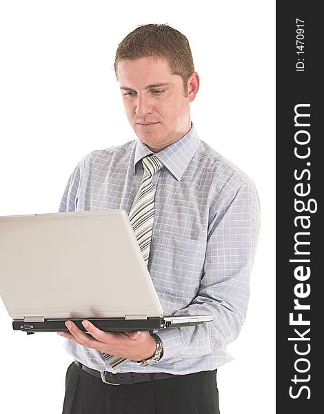 Businessman working on the laptop over white backdrop. Businessman working on the laptop over white backdrop