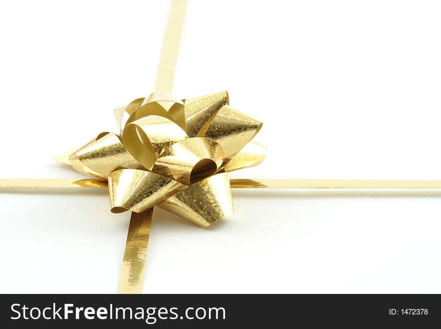 Gold gift ribbon on a white background