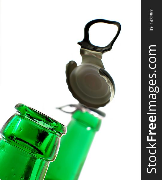 Opening beer bottle isolated over white background