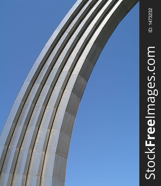 Steel arch over blue sky background. Steel arch over blue sky background
