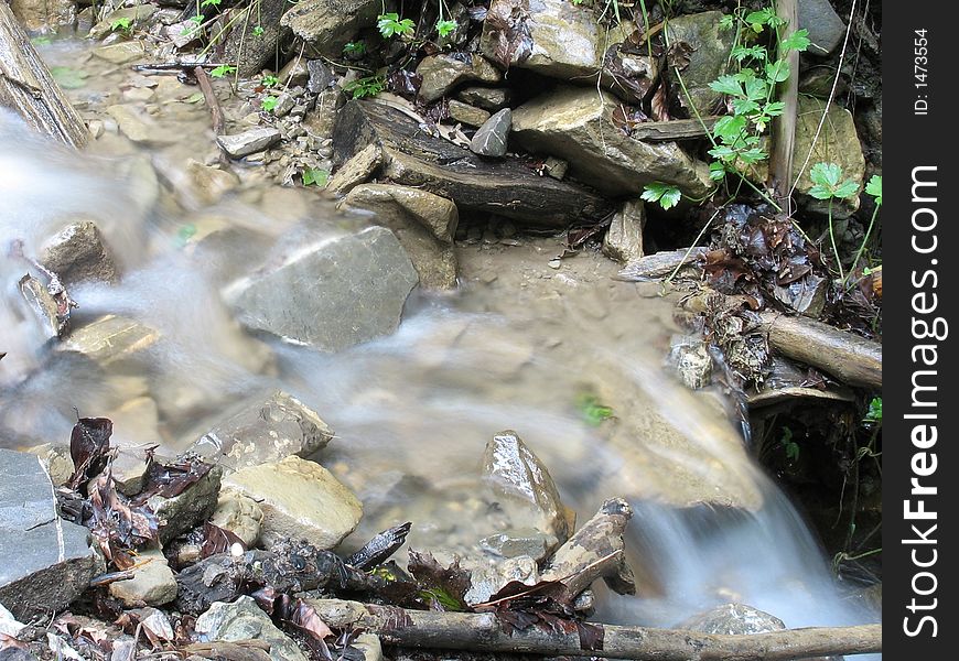 Water flowing through some rocks. Water flowing through some rocks