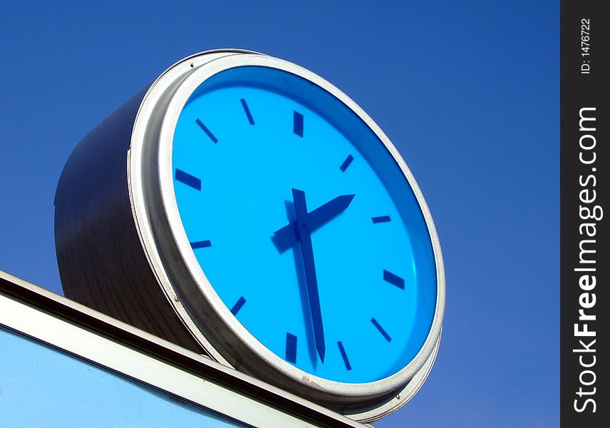 Detail from urban street - blue colored public clock. Detail from urban street - blue colored public clock