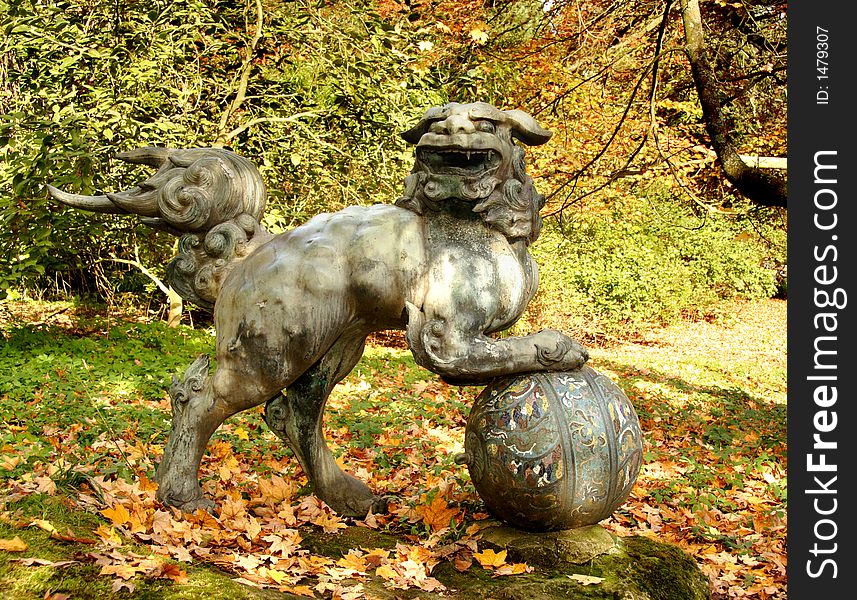 Sculpture in an English Park surrounded by Autmn leaves. Sculpture in an English Park surrounded by Autmn leaves