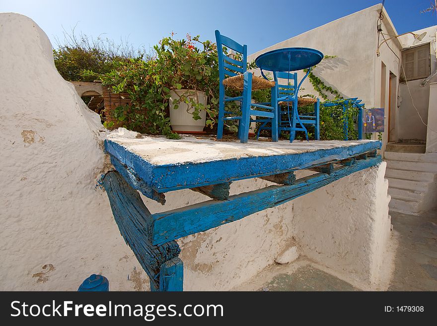 Table on a precarious balcony, Naxos, Greece. Table on a precarious balcony, Naxos, Greece
