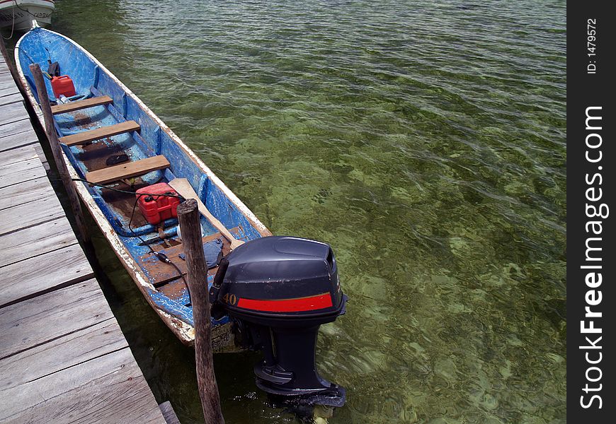 Canoe on cristal clear tropical water