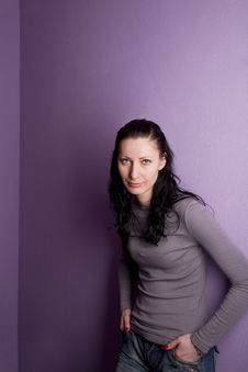 Lonely Woman Grieves On Purple Background Royalty Free Stock Photos