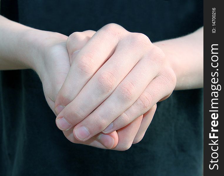 Two hands holding something held out in front of person's body. Two hands holding something held out in front of person's body