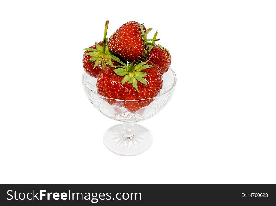 Strawberries in a glass isolated on white background