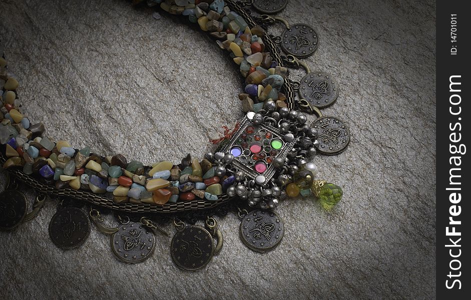 Traditional style colorful necklace on the shiny stone. Traditional style colorful necklace on the shiny stone