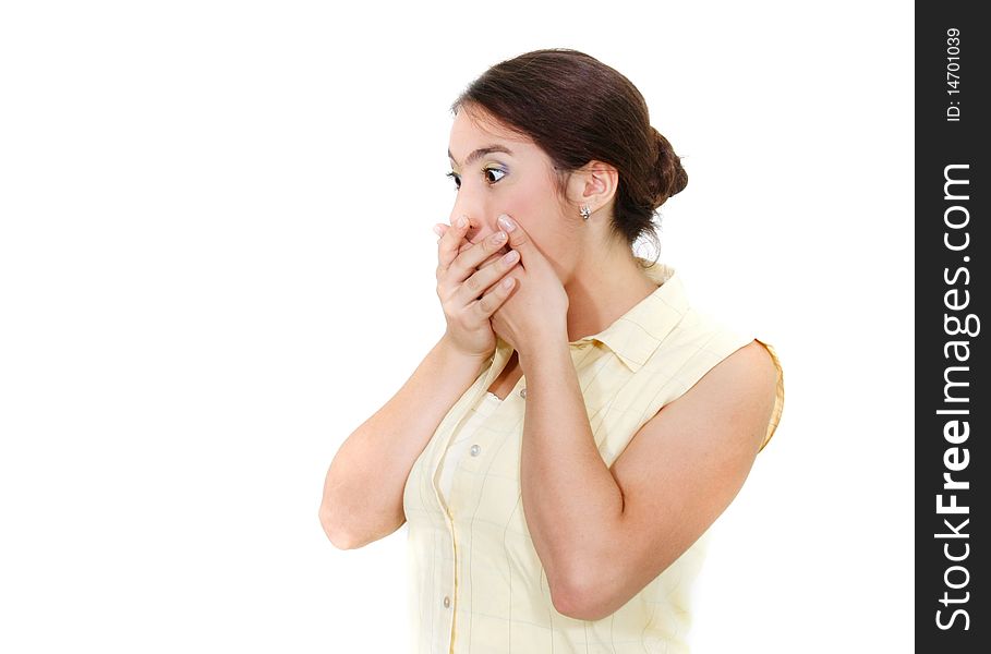 Shocked girl closing her mouth with hands over white