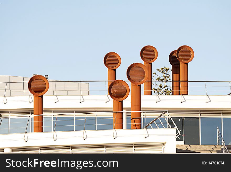 Modern building with industrial chimneys