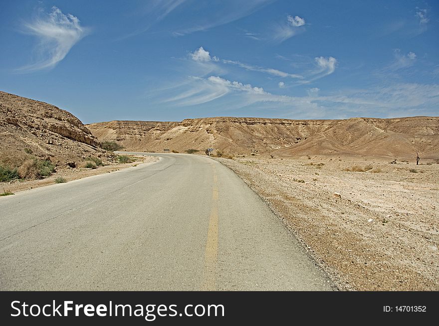 Narrow, old and rarely used road in the Arava desert. Narrow, old and rarely used road in the Arava desert