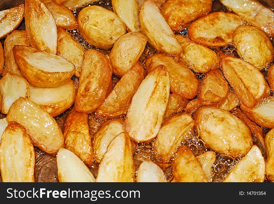 Roasted new potatoes background detail. Roasted new potatoes background detail