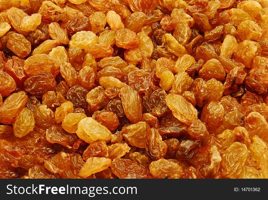 Golden raisins background texture detail