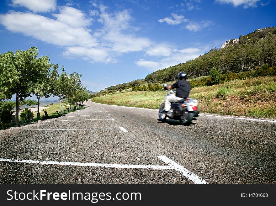 Motorist on the road with mountain scenery. Motorist on the road with mountain scenery