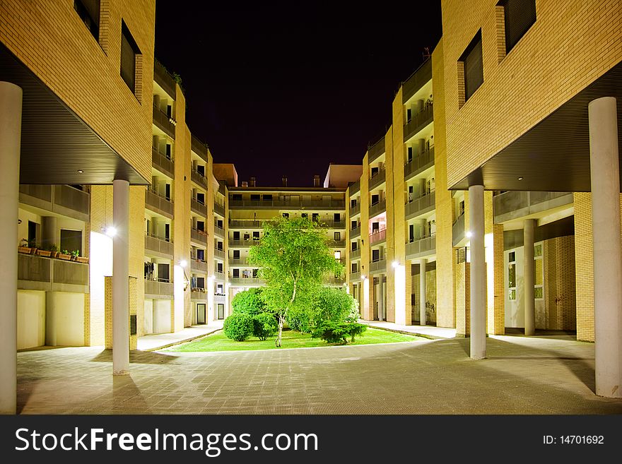 Inside of a block of flats with garden and tree. Inside of a block of flats with garden and tree