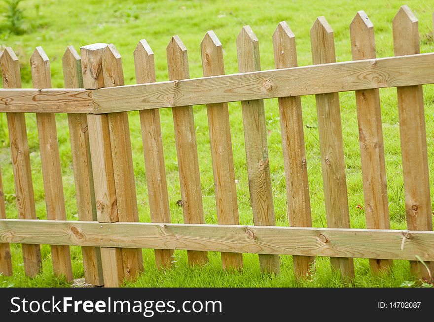 The wooden fense in the garden