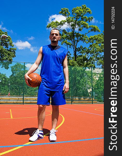 Young basketball player with ball on the sportground. Young basketball player with ball on the sportground