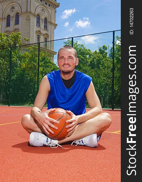 Young basketball player with ball on the sportground. Young basketball player with ball on the sportground