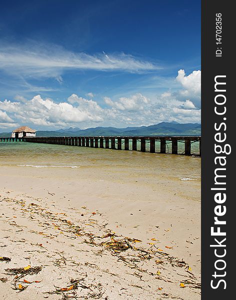 Tropical Beach Dock on a White Beach