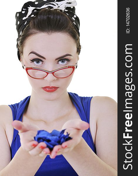 Pretty young woman with red eyeglassess hold blue flower petals ins hands isolated on white. Pretty young woman with red eyeglassess hold blue flower petals ins hands isolated on white