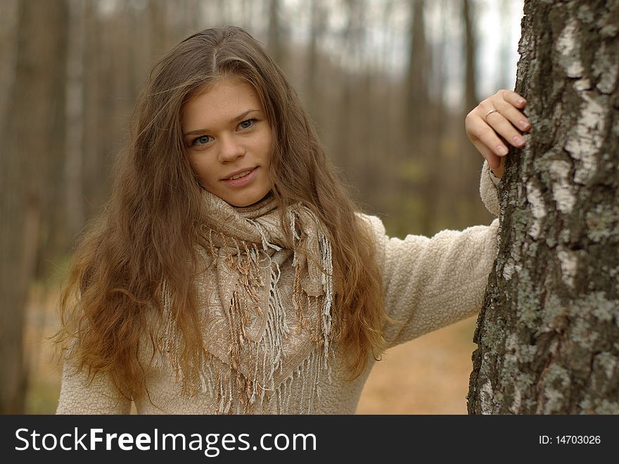 Girl leaning against a birch tree. Girl leaning against a birch tree