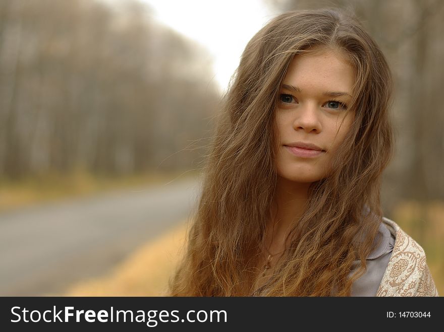 A portrait of a girl on a road