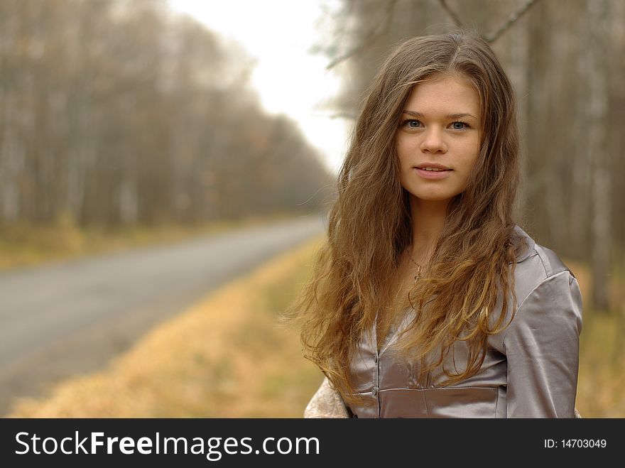 A portrait of a girl on a road