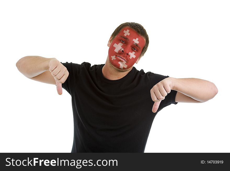 Man with swiss flag painted on his face showing two thumbs down, isolated on white background. Man with swiss flag painted on his face showing two thumbs down, isolated on white background