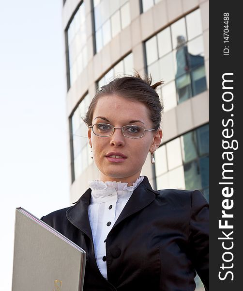 Young businesswomen with diary in her hands with glasses