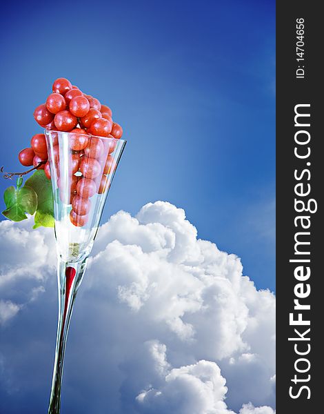 Grapes In An Elegant Glass Against Blue Sky