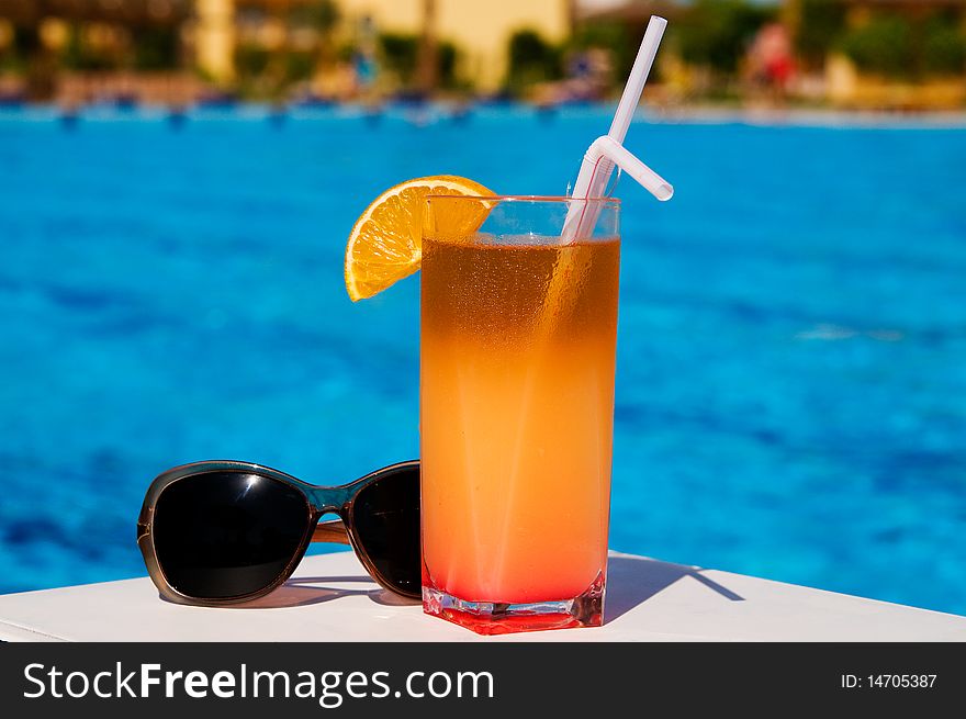 Glass Of Tasty Juice With Pipes And Sunglasses.