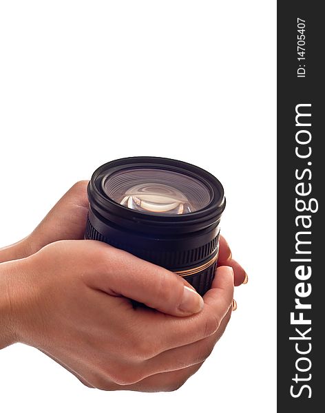 Black photo lens in woman's hands. Isolated on white. Black photo lens in woman's hands. Isolated on white