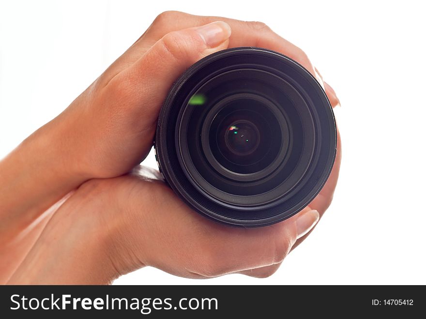 Photo lens in woman's hands. Isolated on white background. Photo lens in woman's hands. Isolated on white background