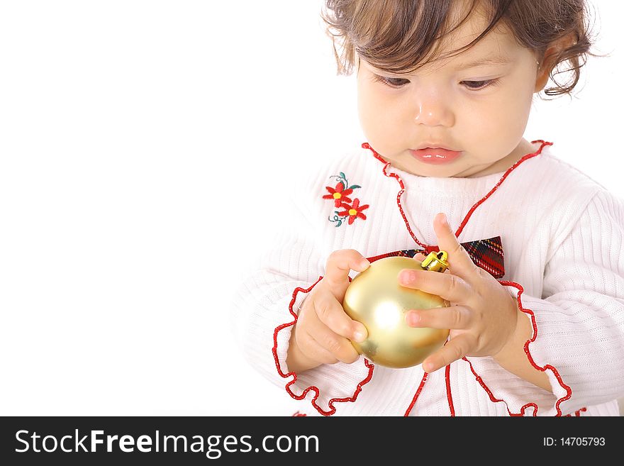 Image of a young baby looking at an ornament