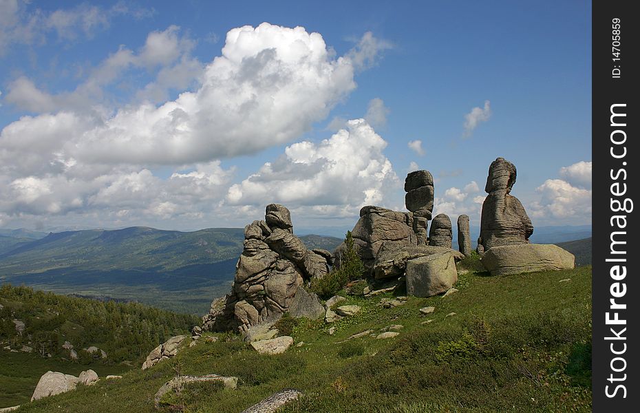 The Altay mountainous landscape with granite rocks against the blue sky. The Altay mountainous landscape with granite rocks against the blue sky