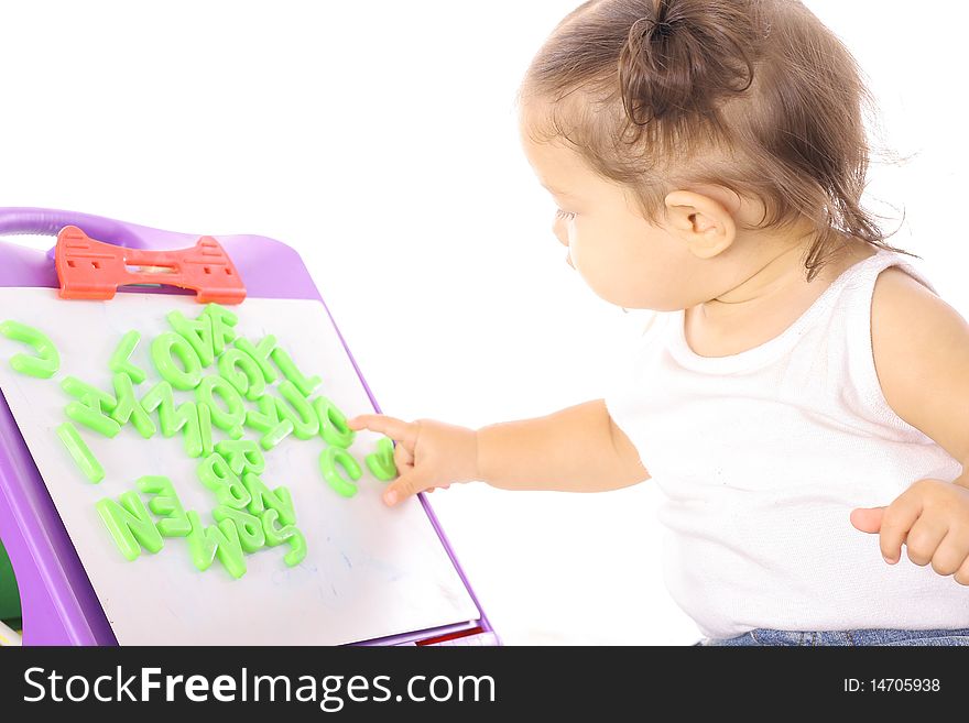 Shot of a little girl playing with ABC