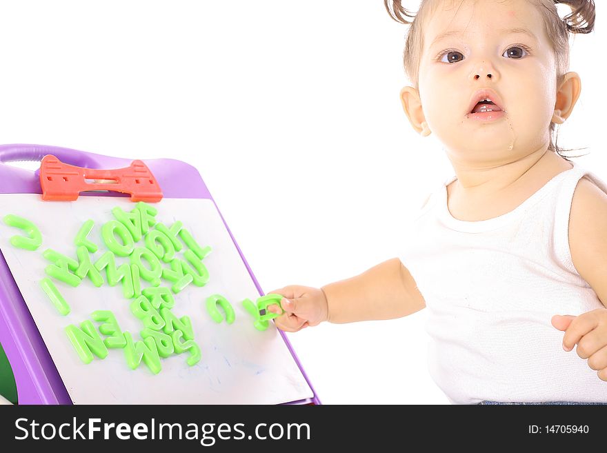 Shot of a cute little girl playing with ABC