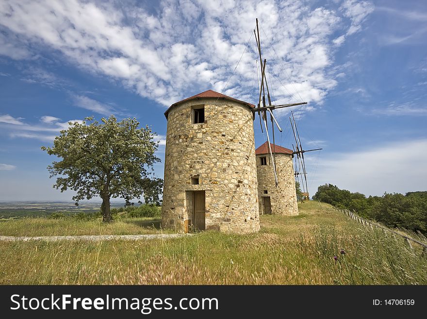 Traditional built with stones windmill in Greece. Traditional built with stones windmill in Greece