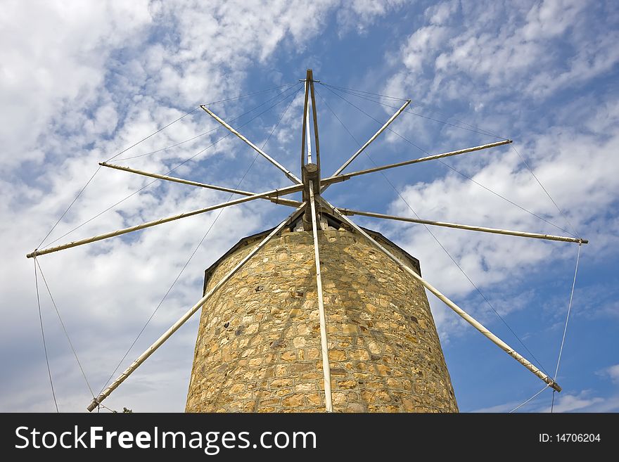 Traditional  built with stones windmill in Greece. Traditional  built with stones windmill in Greece