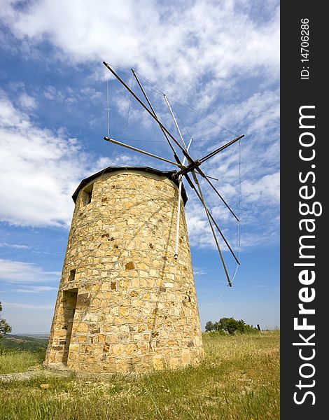 Traditional built with stones windmill in Greece. Traditional built with stones windmill in Greece