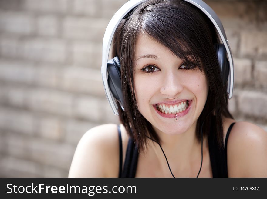Young happy girl listening to music. Young happy girl listening to music.