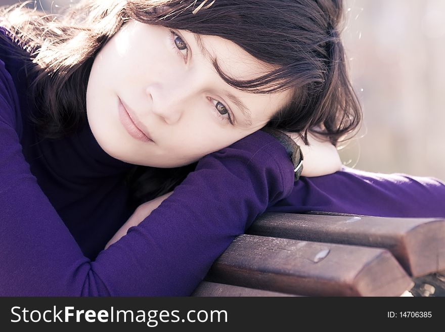 Close portrait of good looking woman in bench. Close portrait of good looking woman in bench