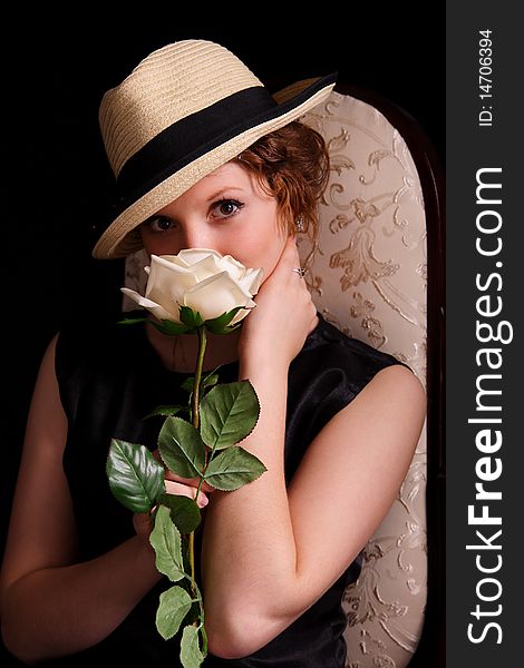 Portrait of the beautiful young woman with a rose. Portrait of the beautiful young woman with a rose