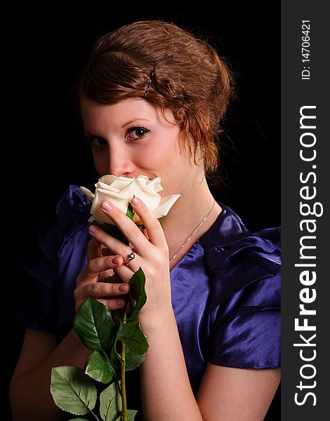 Portrait of the beautiful young woman with a white rose. Portrait of the beautiful young woman with a white rose
